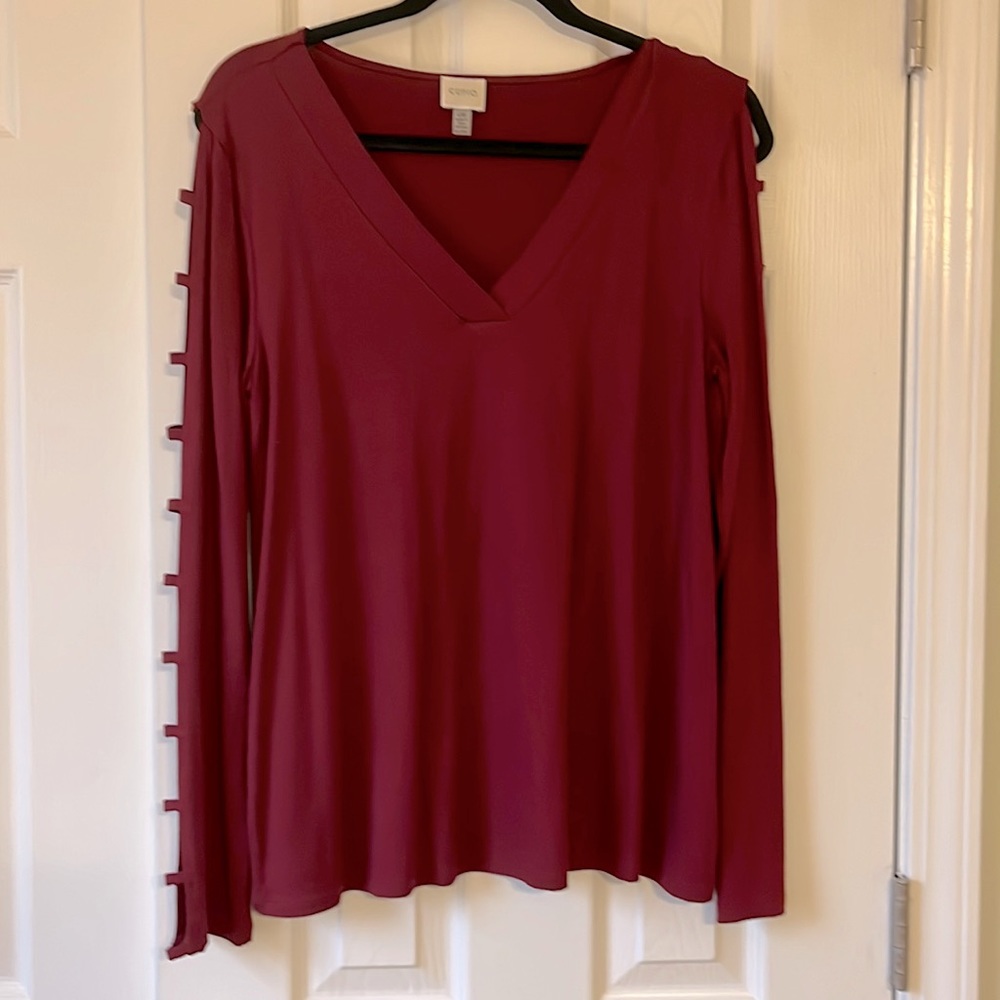 V-Neck tunic shirts with block cutouts down the arms. Size Large